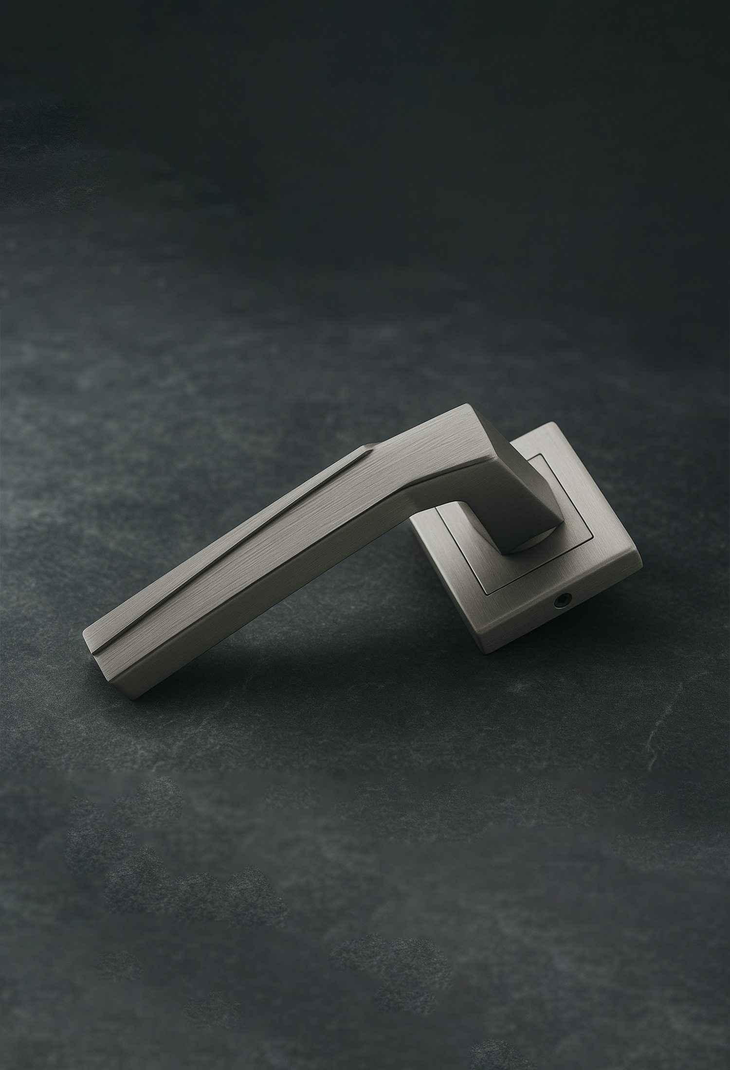 Silver KEPA 501 rosette door handle placed on grey marble surface