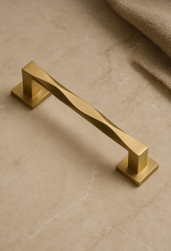 Gold TIDLO 97 outdoor handle placed on a marble3 surface
