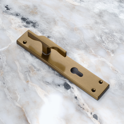 TIDLO 502 Half Handle satin sheen gold placed on a circular marble surface
