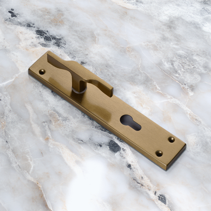 TIDLO 502 Half Handle satin sheen gold placed on a circular marble surface