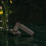 KEPA 501 silver door handle placed on a green marble surface
