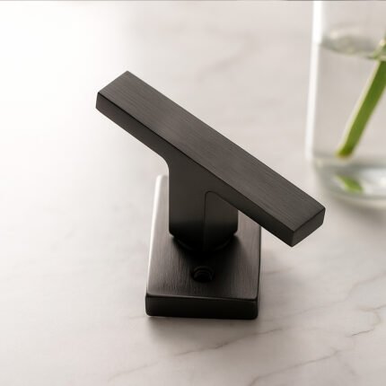 TIDLO 505 grey window handle placed on a table