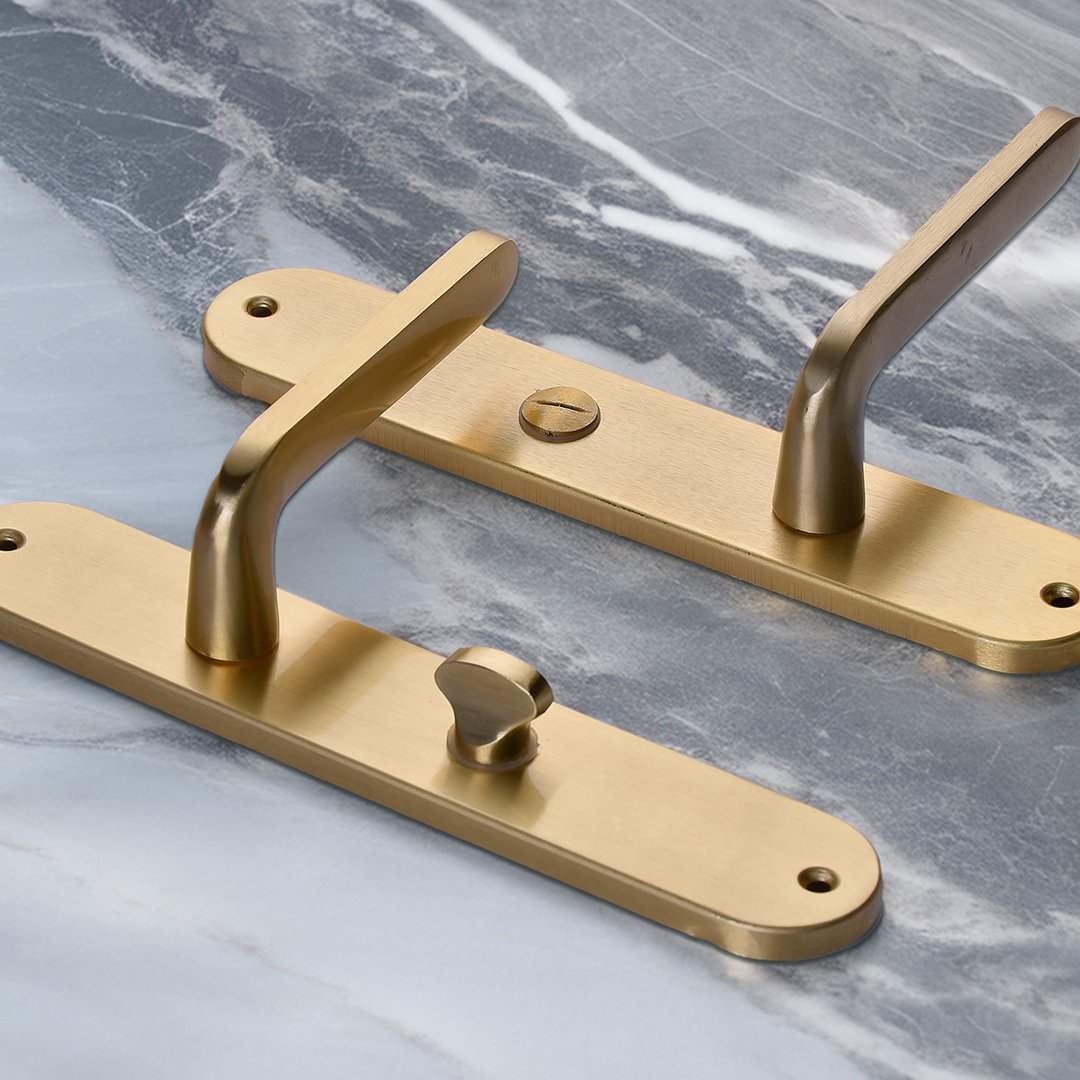 TDILO-509-gold TIDLO 509 gold bathroom handle placed on a marble surface